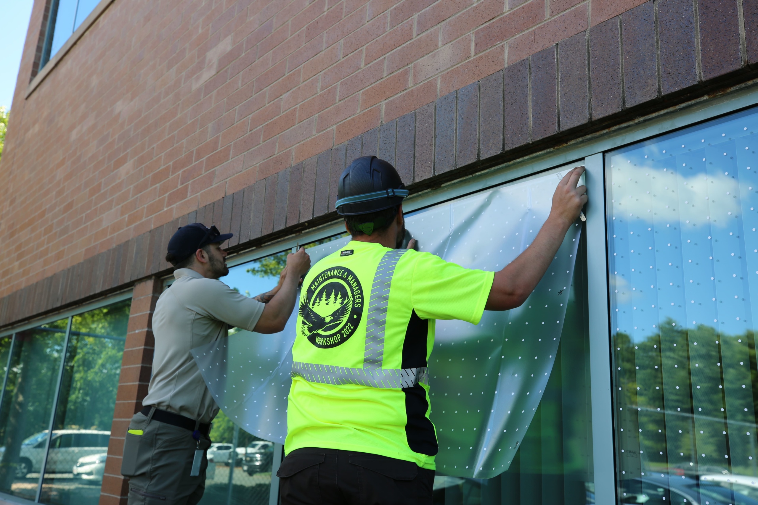Maintenance professionals install feather friendly at US FWS Northeast Regional Office Courtesy US FWS, Leah Riley, Photographer